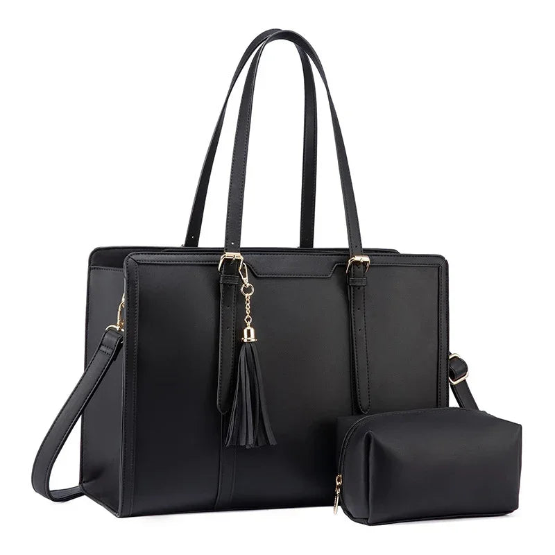 Black leather tote handbag with gold hardware and matching small pouch against white background