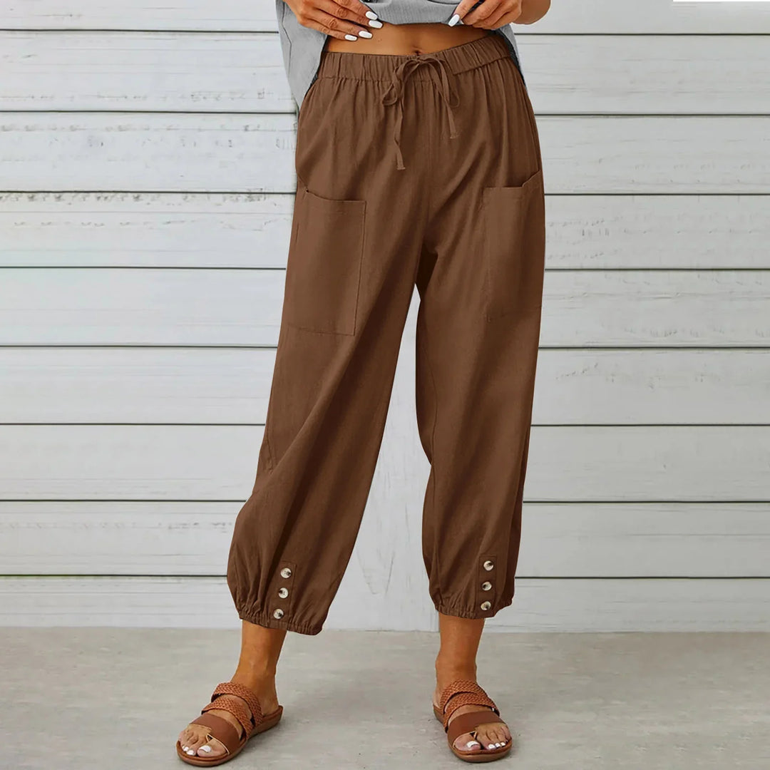 Brown casual cropped pants with drawstring waist, front pockets, button cuffs, and sandals