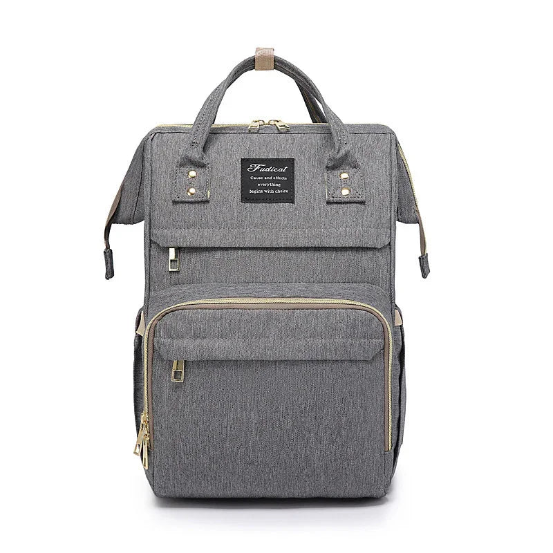 Stylish gray fabric backpack with front zipper pockets and top handles, modern design