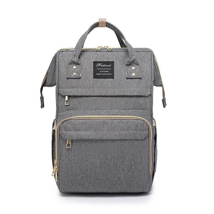 Stylish gray fabric backpack with front zipper pockets and top handles, modern design