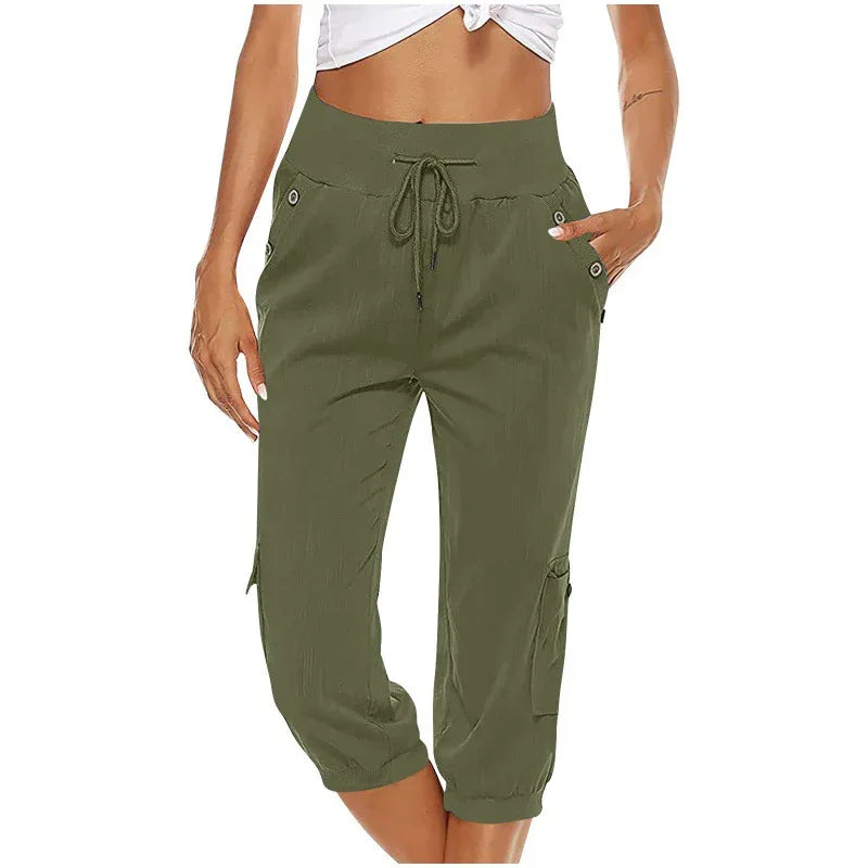 Women wearing olive green casual cropped cargo jogger pants with drawstring waist and pockets