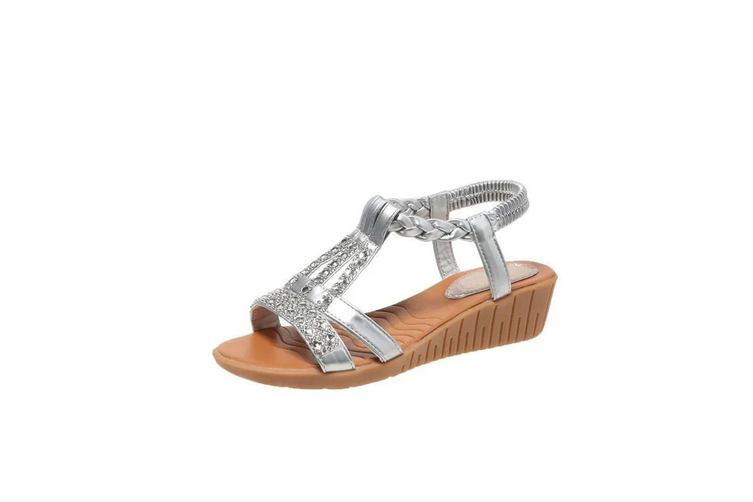 Silver braided strap wedge sandal with rhinestone accents and tan sole