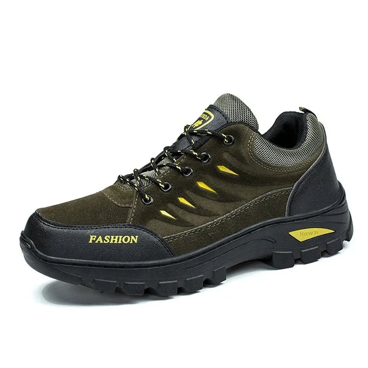 olive green and black durable hiking shoe with yellow accents and rugged sole