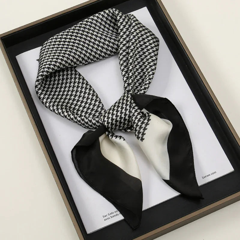Black and white houndstooth silk scarf with black and white border, stylishly knotted in luxury box