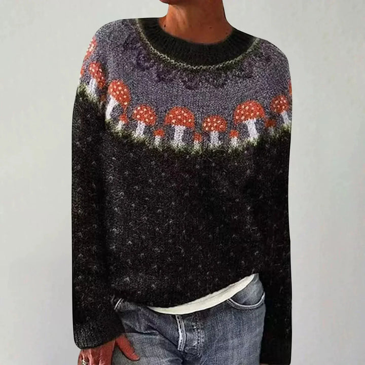 Cozy black sweater with red and white mushroom pattern around the yoke worn with blue jeans