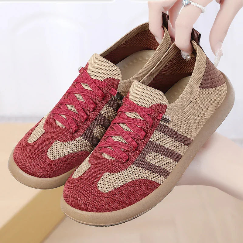 Lightweight knit sneakers with red and beige color block design and flexible rubber sole