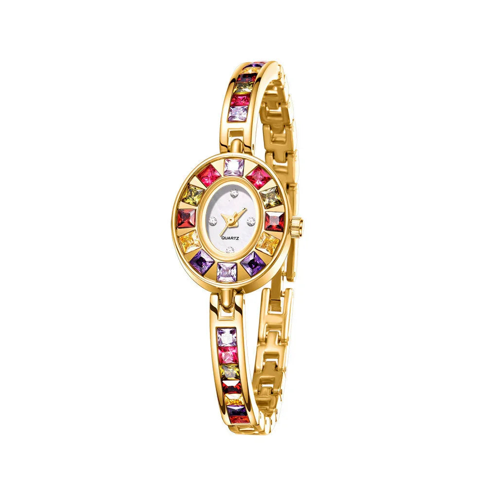 Gold bangle quartz watch with multicolored square gemstones on bezel and strap