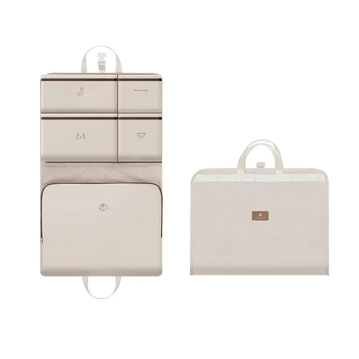 Beige travel organizer with multiple labeled compartments for socks, bras, underwear, and shirts, foldable with handle