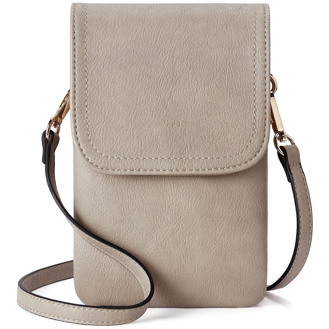 Small taupe crossbody bag with flap closure and adjustable strap on white background