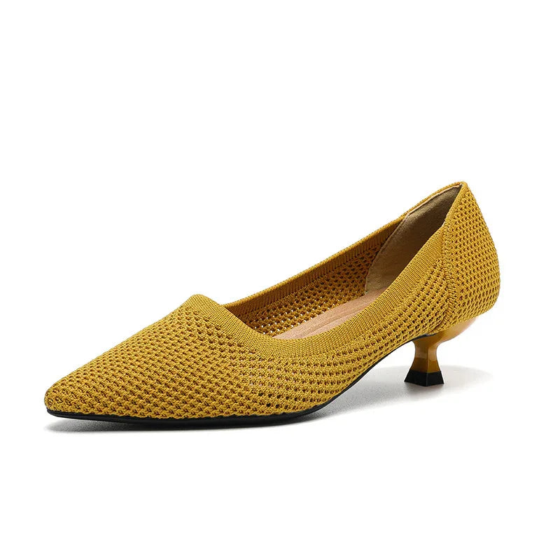 Yellow knit pointed toe kitten heel shoe with textured pattern and black sole