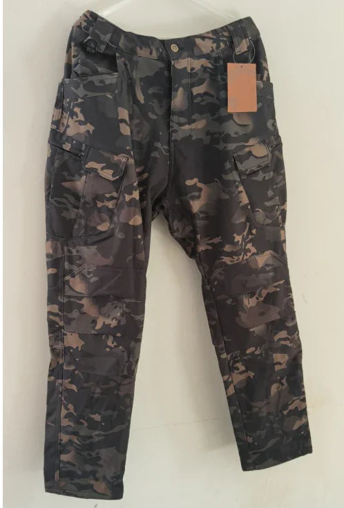 Men's camouflage cargo pants with multiple pockets and a button closure on a plain background