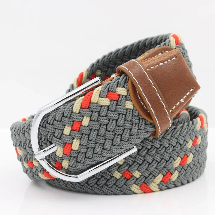 Gray woven fabric belt with red and beige accents and brown leather buckle loop