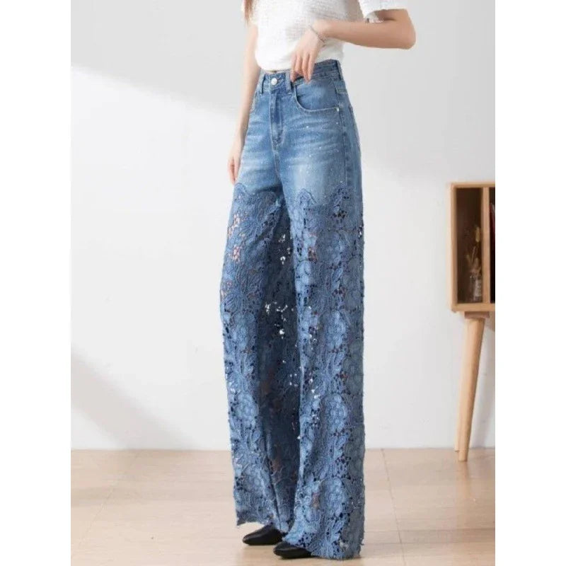 Woman wearing high-waisted wide-leg denim jeans with floral lace detailing at the bottom