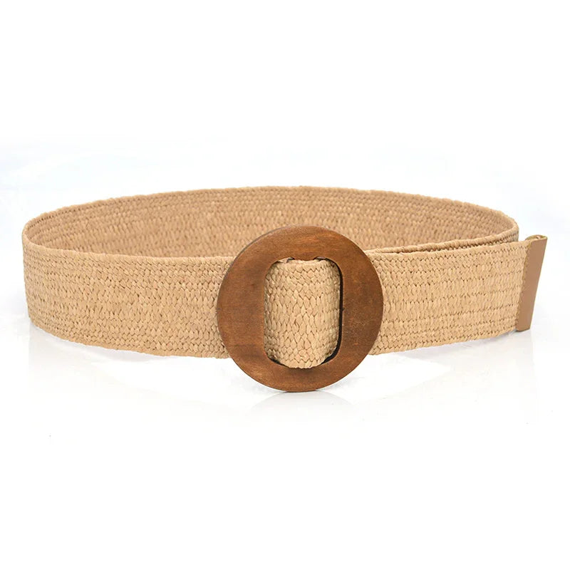 Beige woven fabric belt with a large round wooden buckle on white background