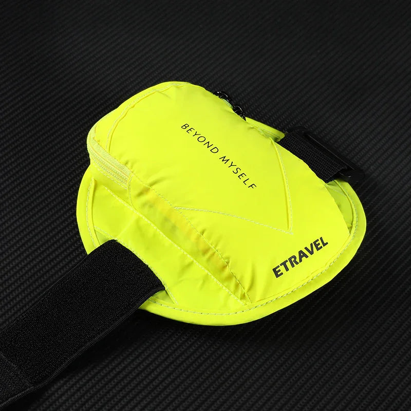 Bright yellow ETRAVEL pouch with zipper and Velcro strap on a black textured surface