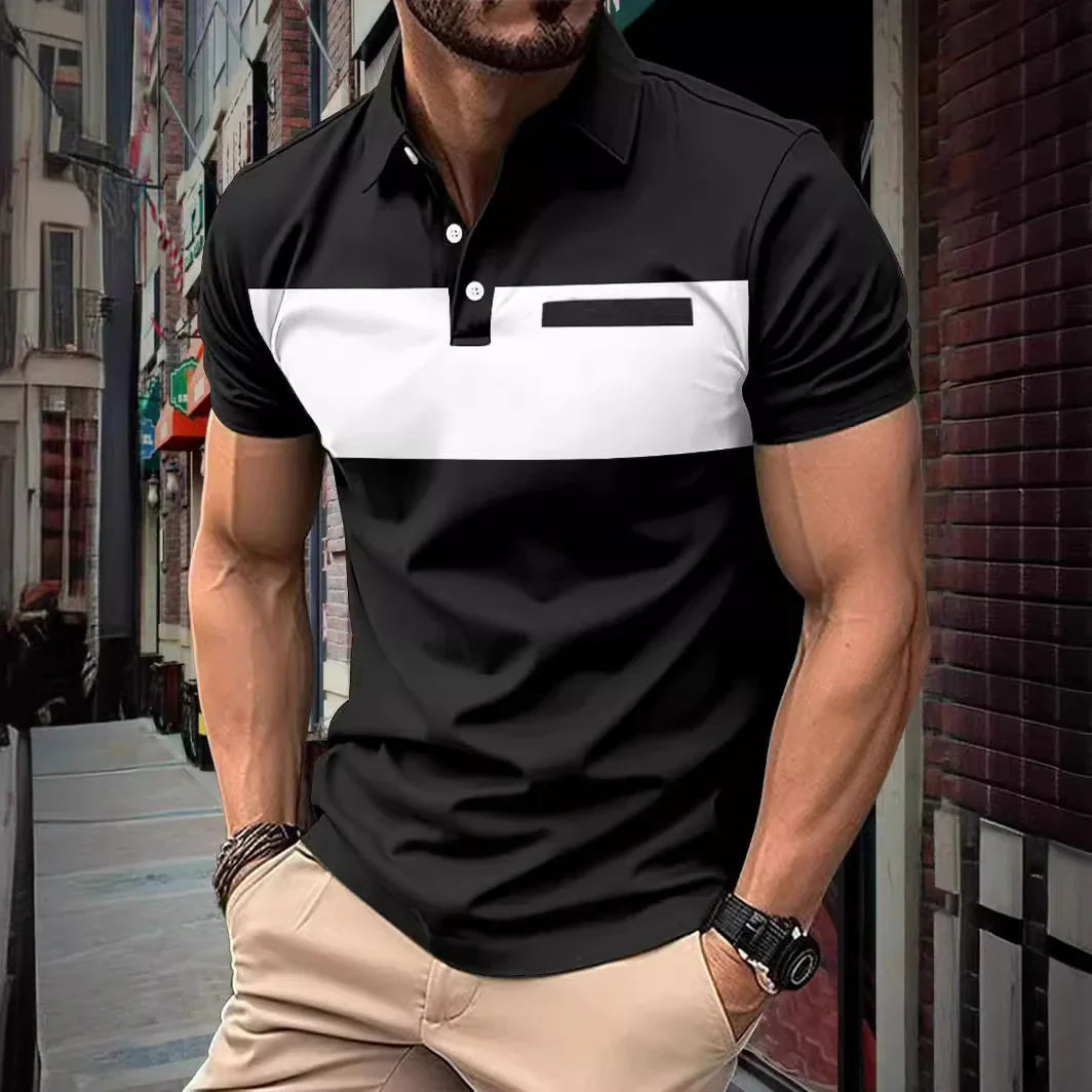 Muscular man wearing black and white color block polo shirt with beige pants in urban street setting