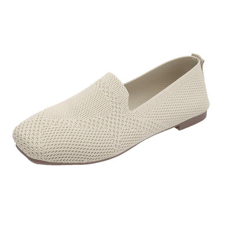 Beige woven slip-on flat shoe with squared toe and low brown sole