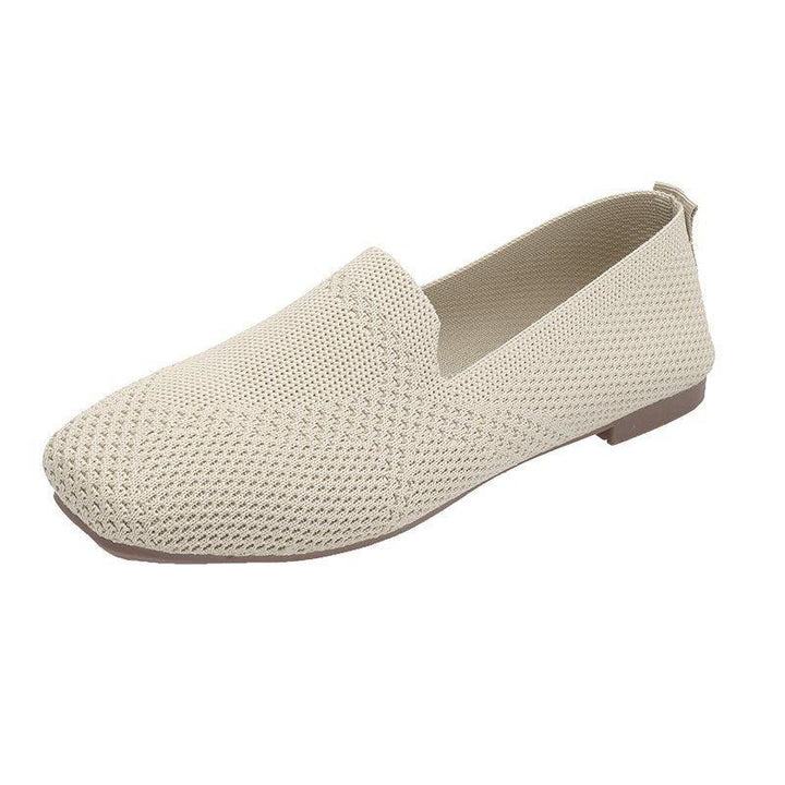 Beige woven slip-on flat shoe with squared toe and low brown sole
