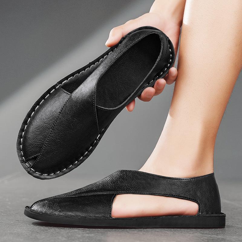 black leather casual sandals with open side design worn on foot and held in hand