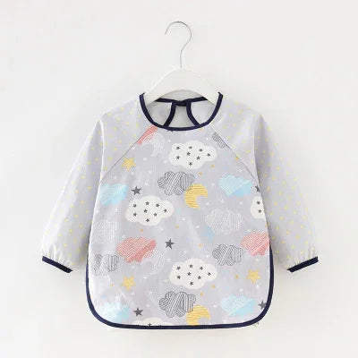 Long-sleeve baby bib with cloud, star, and moon prints in pastel colors, navy trim