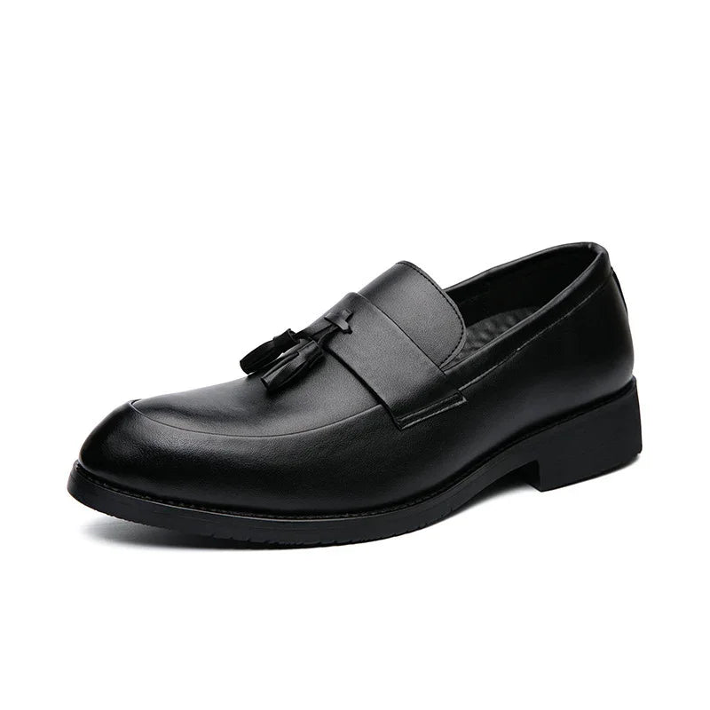 Black leather men's tassel loafer shoe with low heel on white background