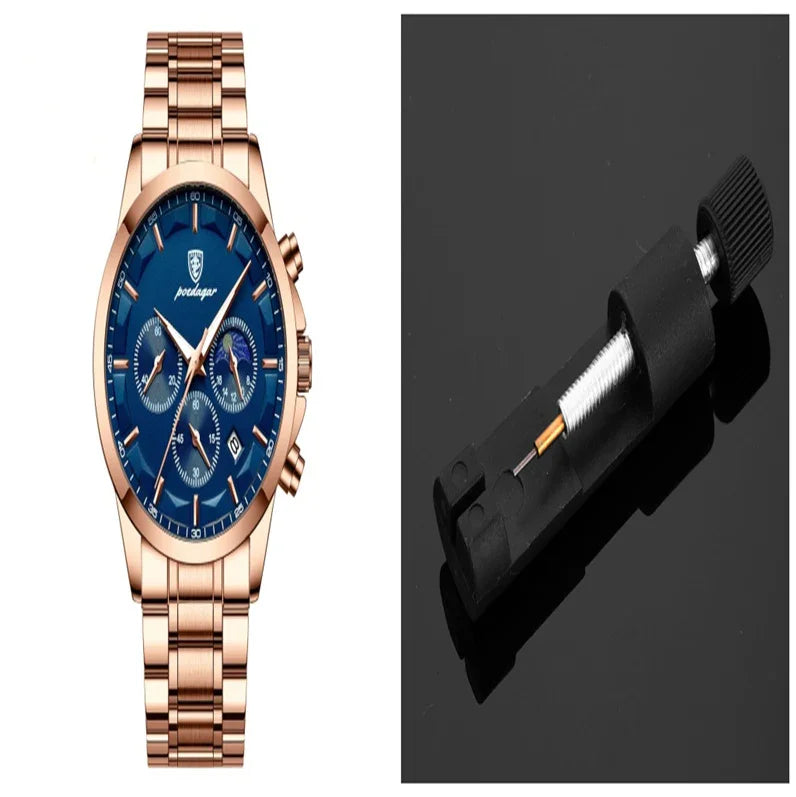 Rose gold wristwatch with blue dial and chronograph beside black watch band spring bar tool