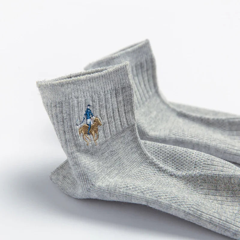 Pair of grey ribbed crew socks with embroidered blue rider on horse logo detail