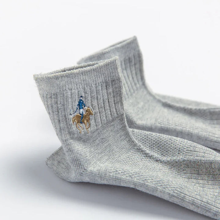 Pair of grey ribbed crew socks with embroidered blue rider on horse logo detail