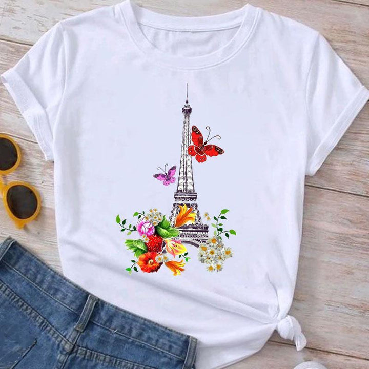 White t-shirt with Eiffel Tower graphic, colorful flowers, and red and pink butterflies