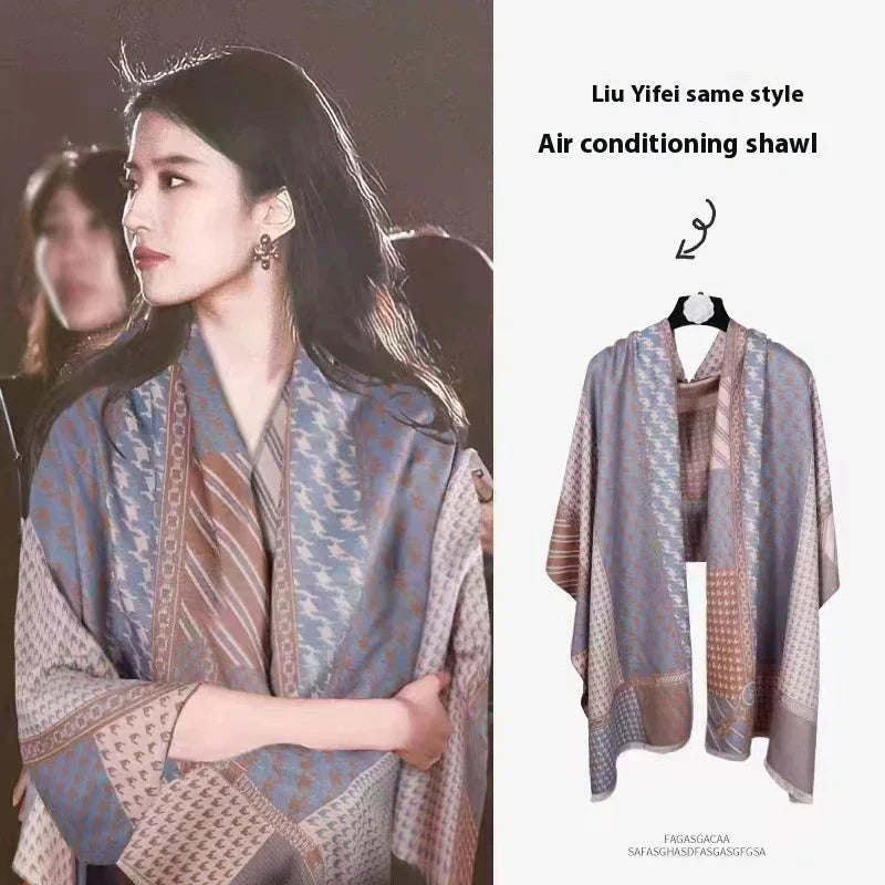 Woman wearing patterned air conditioning shawl in blue, brown, beige hues, styled like Liu Yifei