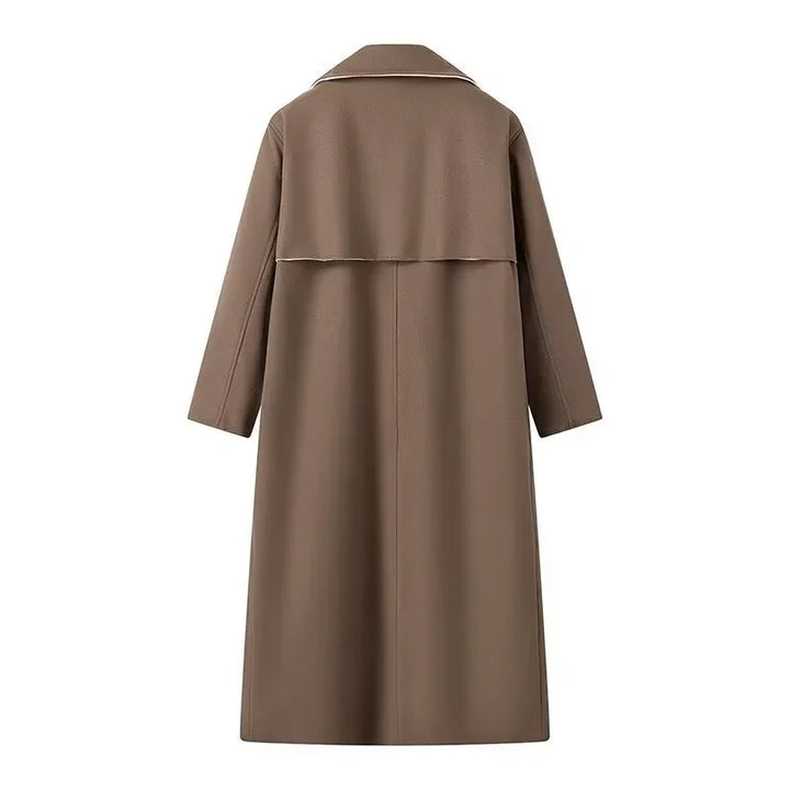 Back view of long brown trench coat with wide collar and storm flap detail