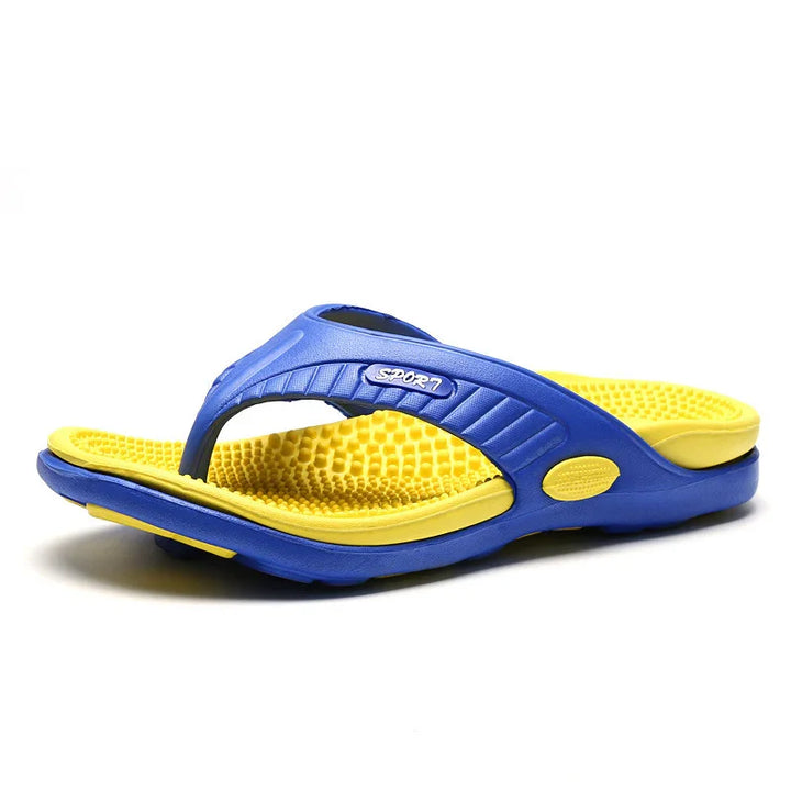 Blue and yellow sport flip flop sandal with textured footbed on white background