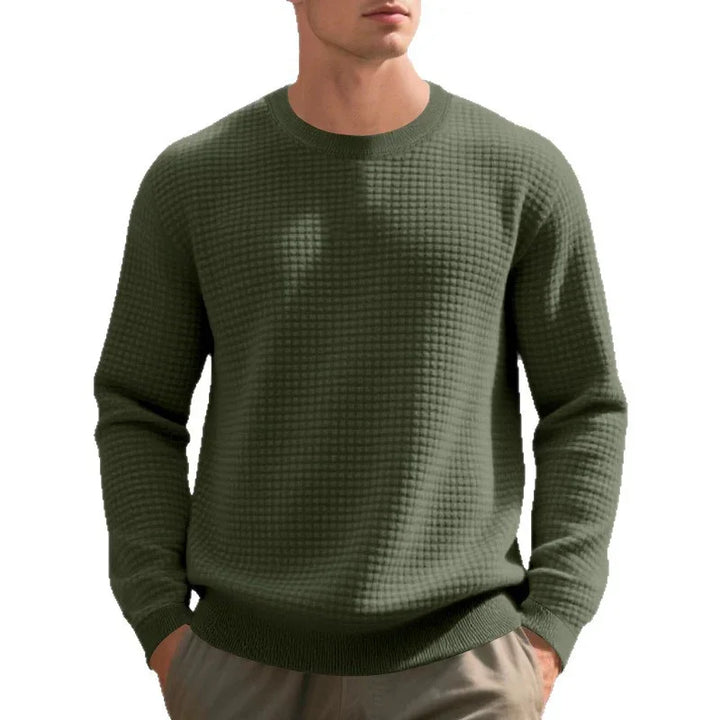 man wearing olive green waffle knit sweater with crew neck and khaki pants