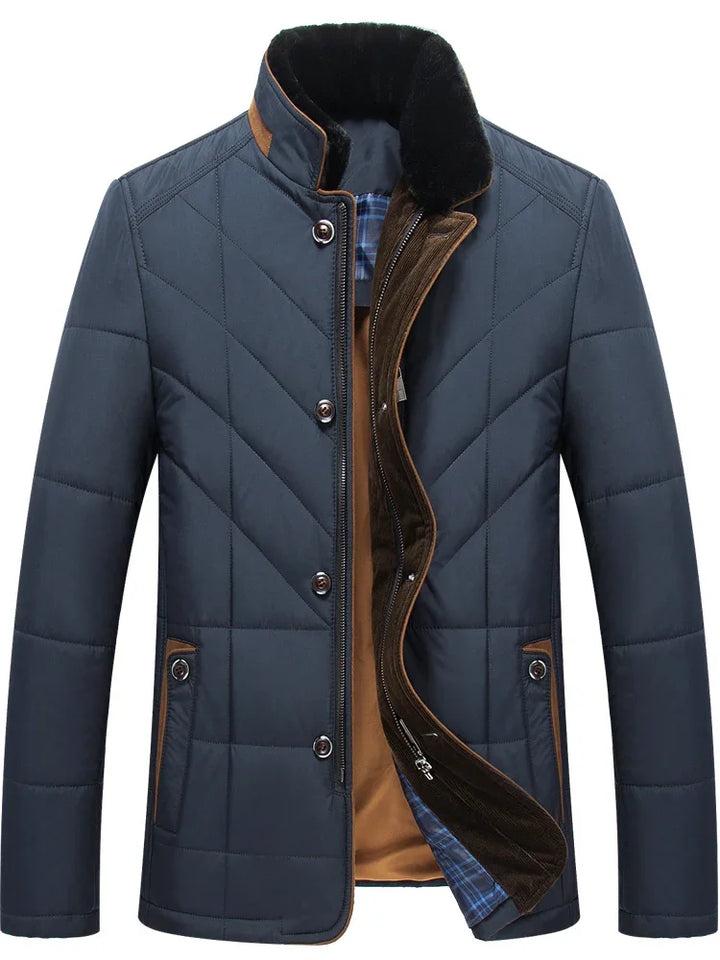 Men's navy blue quilted winter jacket with brown trim, button and zipper closure, and soft inner lining