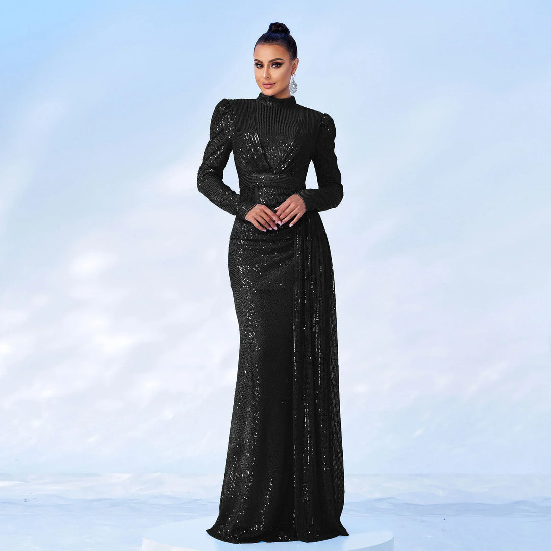 Elegant woman in a black sequined long sleeve evening gown with draped detail on a light background