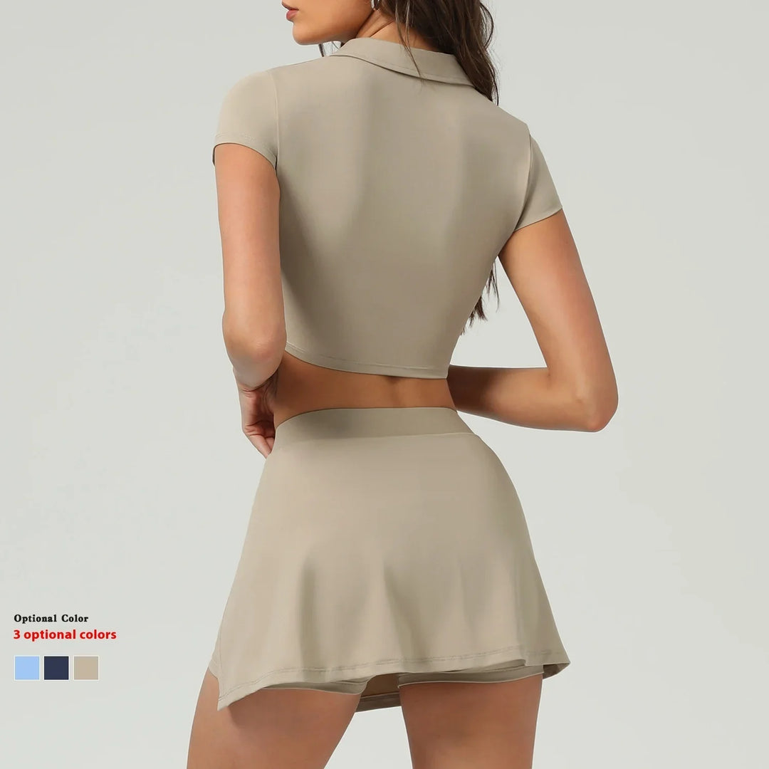Rear view of woman wearing beige short-sleeve crop top and matching flared mini skirt