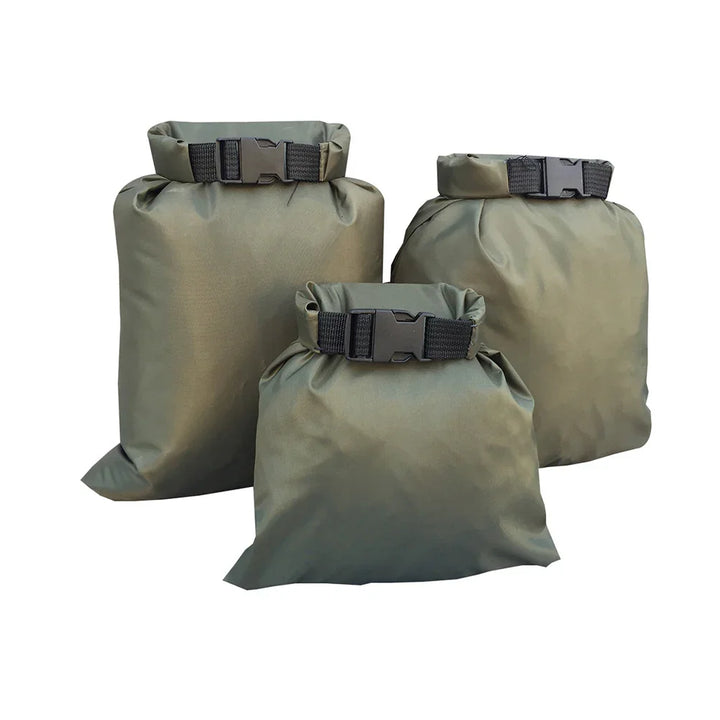 Set of three olive green waterproof dry bags with buckles, outdoor camping gear