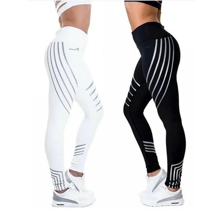 Side view of two women wearing high-waisted black and white leggings with grey stripe patterns and white sneakers