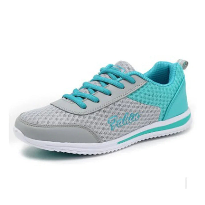 Light gray and turquoise breathable mesh running shoe with turquoise laces and white sole