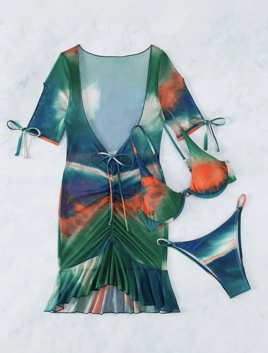 Colorful tie-dye bikini set with matching mesh beach cover-up dress on white background