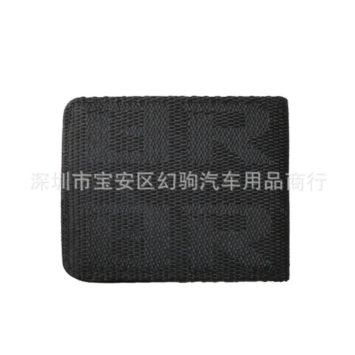 Black woven wallet with textured checkered pattern on white background