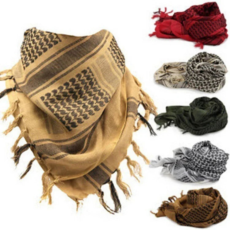 Collection of traditional keffiyeh scarves in various colors including tan, red, green, and black with fringe edges