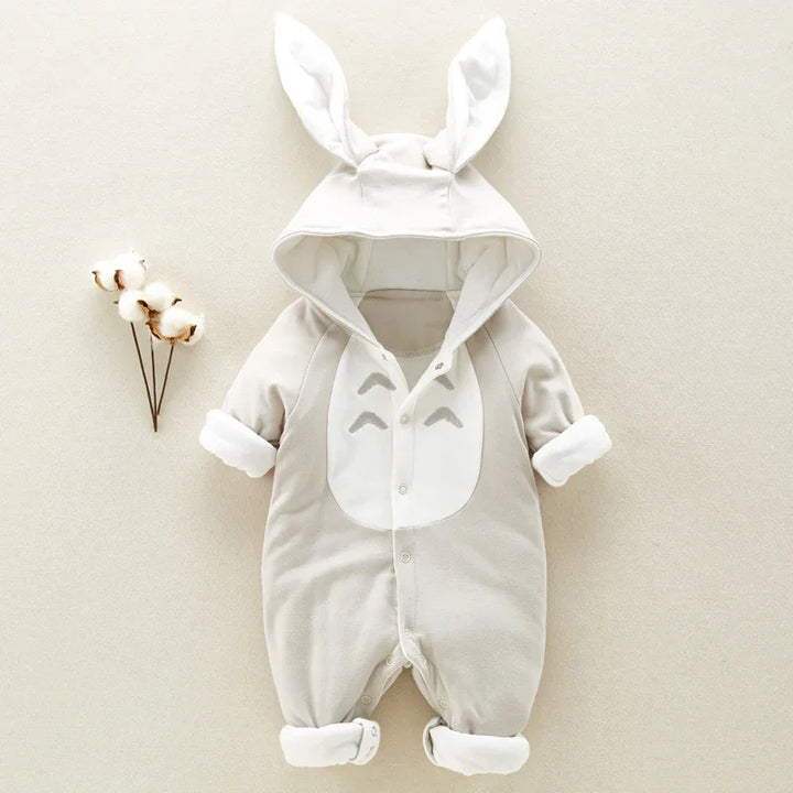 Beige baby onesie with bunny ears hood and rolled cuffs, soft cotton fabric