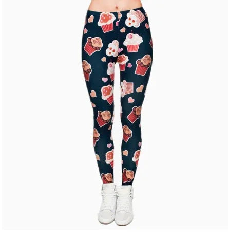 Women's navy leggings with colorful cupcake and heart print, paired with white sneakers
