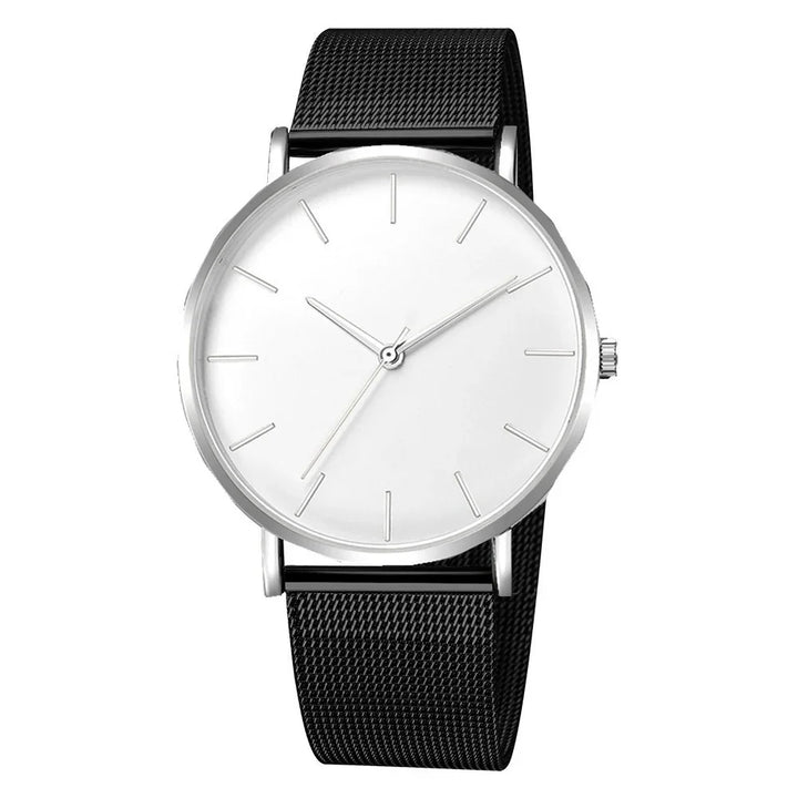 Minimalist silver wristwatch with white dial and black mesh band, no numbers
