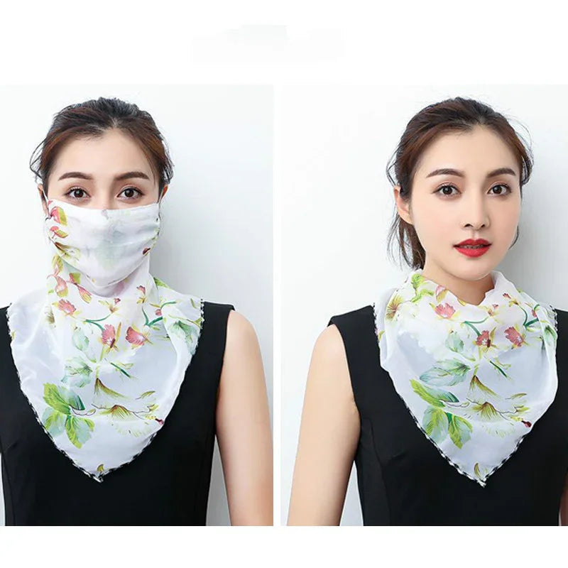 Woman wearing floral multifunctional white scarf as face mask and neck cover with black sleeveless top