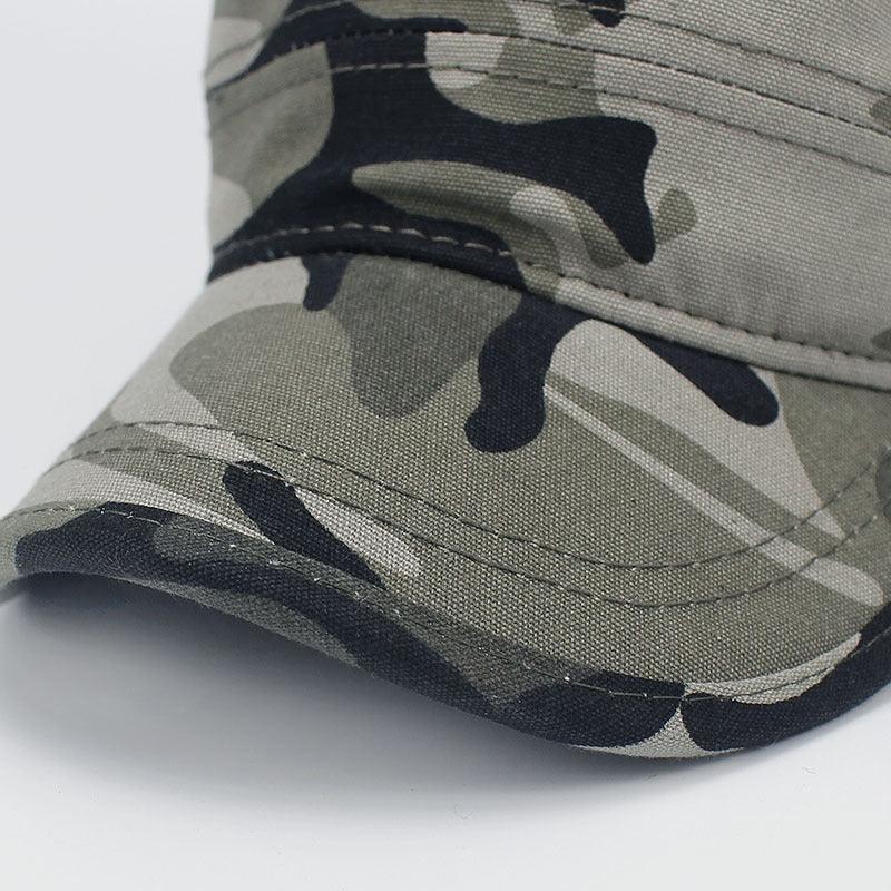 Close-up of a camouflage baseball cap with green, black, and gray pattern