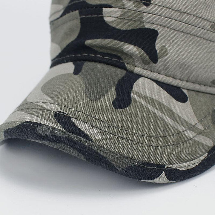 Close-up of a camouflage baseball cap with green, black, and gray pattern