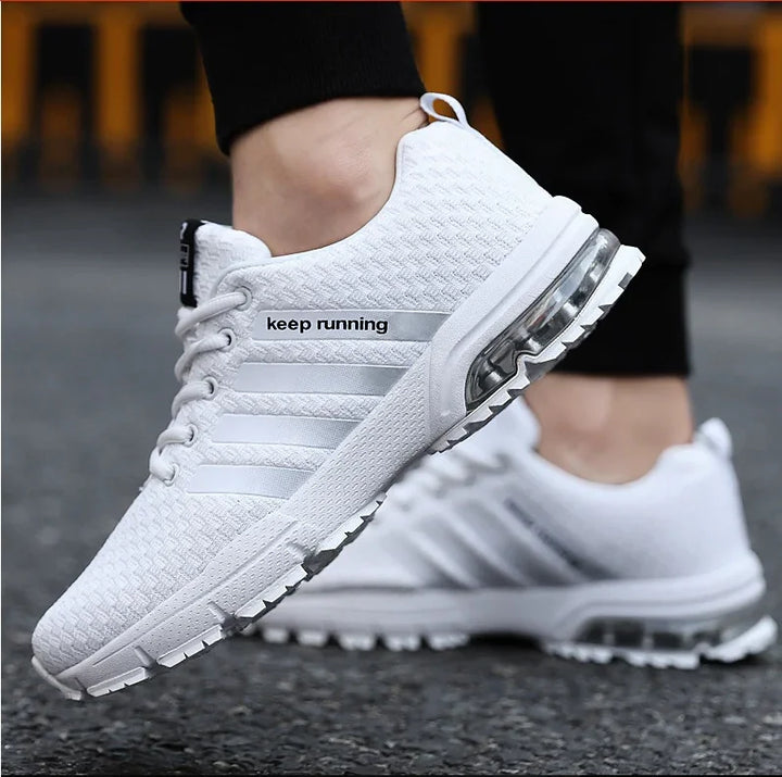 White breathable mesh running shoes with cushioning sole and keep running text on side