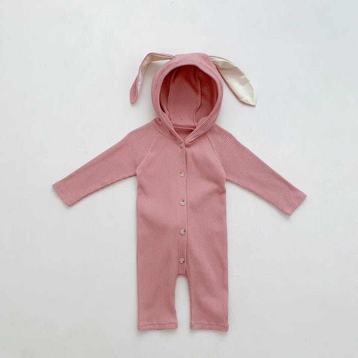 Pink ribbed baby onesie with long sleeves, buttons, and hood with bunny ears
